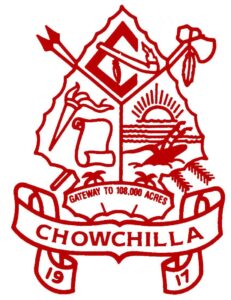 Red outlined crest with a sun, field, plow, scroll, tools, and livestock. Banner below reads Gateway to 108,000 Acres, CHOWCHILLA, 1917..